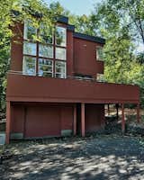 Before: Kristin refers to the previous rear facade as the "gauntlet," as maneuvering cars into the garage between the many structural posts was a frustrating experience.