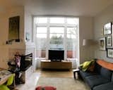 Before: The existing living room windows were very drafty, and at the top there was an opening to the upstairs primary bedroom.