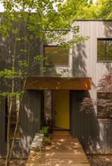 After adding layers of exterior insulation and new windows for an energy retrofit, the team replaced the siding with open-gap cedar cladding and COR-TEN accents.