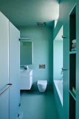 The architects kept the fixture layout to save on budget, swapping in a Duravit tub and toilet with lavatory fixture, tub filler and shower head and controls by DornBracht.