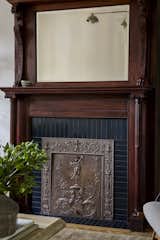 Deep blue Heath Ceramics tile accents the fireplace surround, which was relocated from the back room.