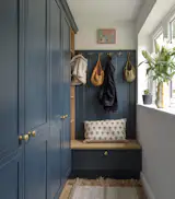 Architect Simon Knight of Simon Knight Architects relocated the kitchen, and placed a boot room in its place. The painted cabinets are from Alban Furniture.