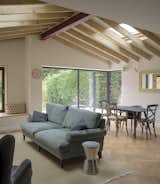 Large sliding doors by Cortizo bring in more light and connection.