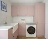 Knight also installed a utility room where the kitchen used to be. The pink cupboards are from Howdens.