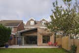 In the extension, Knight combined differing brickwork textures, a steel overhang for shading, and timber detailing around the "splayed reveal