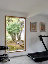 The couple converted one of the four bedrooms into a dedicated gym, with Nike Grind flooring, a material made from recycled athletic shoes.