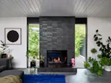 The fireplace has INAX Tile from United Tile.