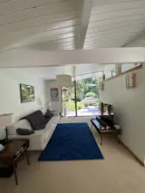 Before: The flooring was changed throughout, and this room received new lighting, rug, and furnishings.