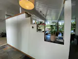 Before: A stepped wall blocked sightlines between the entrance through the atrium, and the window wall at the backyard.