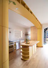 The arched installation is 16.5 feet wide. The wood on the island was salvaged from the house during demolition, and Kev refinished it to be added to the island.