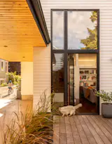 The roof of the carport creates a sheltered open play area for the kids for when it rains, as well as more coverage when Charlotte and Adam are loading or unloading the car.