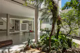 The fixed glass was swapped out for stacking glass doors that open the house to the garden.