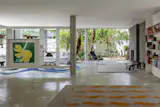 Now, more light and access to the garden permeates the layout. "Inverted beams allow for a completely clean ceiling without visual interference,