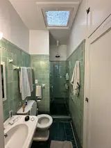 Before: "We flipped everything over to the inside wall and that made a single plumbing wall for all three bathroom spaces,