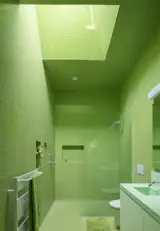 The tile covering most surfaces is glass mosaic tile by Interstyle.