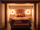 The bedroom has two Arundel Surface Mount lights by In Common With.