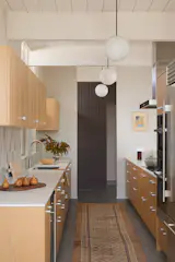 They worked with Space Theory so the white oak cabinets better maximize the space. The electrician rewired the original lights.