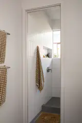 The shower was enlarged, and supports for grab bars for aging in place, mapped out.