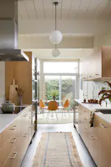 The redesigned layout made space for a breakfast nook at the end of the kitchen.