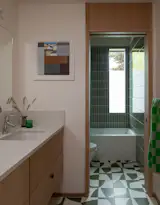 Bath Room, Engineered Quartz Counter, Cement Tile Floor, Undermount Sink, Drop In Tub, Full Shower, and Ceramic Tile Wall The hall bathroom has Strands tile from Concrete Collaborative on the floor, and Fireclay two-by-eight-inch tile in Rosemary on the walls.