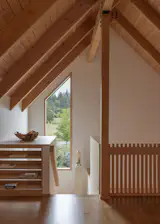 Office, Study Room Type, Chair, Bookcase, and Light Hardwood Floor The loft has two-by-two-inch vertical-grain Douglas fir pickets for guardrails.