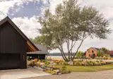 SHED Architecture + Design helped the owners of this two-acre Silverdale property develop a master plan. It included remodeling the existing 1930s brick house into a two-bedroom guest house for their adult children, then building a second home for themselves (and more guests).