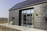 Eva added large glass doors to two sides of the structure. "The design is centered around light, openness, and the relationship to the surrounding landscape,