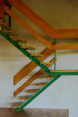 The railing is composed of thick oak boards.