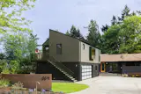 Exterior, ADU Building Type, Small Home Building Type, Shingles Roof Material, Wood Siding Material, and Gable RoofLine The team rebuilt the garage into a two-level, 1487-square-foot ADU. The lower level is a garage, while the upper level has a 780-square-foot apartment.