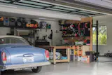 Garage, Garage Conversion Room Type, Storage Room Type, and Detached Garage Room Type The rebuild made room for a small gym area in one corner of the garage, as well as two parking spaces and storage for outdoor gear and tools.