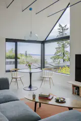 Dining Room, Chair, Table, Ceiling Lighting, Pendant Lighting, and Cork Floor The dining corner has the best view. A Kartell FL/Y pendant in Sky Blue hangs over the table.