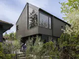 Exterior, Apartment Building Type, ADU Building Type, Small Home Building Type, Shingles Roof Material, Wood Siding Material, and Gable RoofLine Large corner windows capture views of Lake Washington.