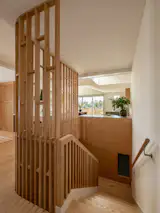 Choe designed storage into the panels at the lining. The interior window is for the new downstairs powder room.