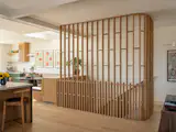 Installation of the screen and its interface with the cabinetry required careful coordination between the contractor and cabinetmaker. Technically, it was the most complex element of the home,