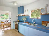 The floors throughout are engineered white oak. The couple considered a cheaper vinyl floor, but since the square-footage of the home is small, decided the wood floors wouldn't be too much more expensive. "I think that's a good return on your investment, just to make it feel a little bit more elevated,