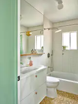 The wall tile is the 2x2 Marian from Bedrosian, and the vanity is Ikea.