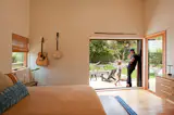 A La Cantina pocket door in the bedroom opens to a patio. "When I went there after they first moved back in, seeing the way that they live in the house really brought me such joy,