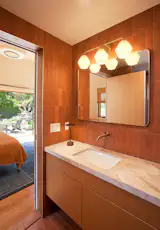 The faucet is by VOLA.