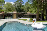 The pool was resurfaced and now has Clay Imports tile. The seating is from <a href="https://www.bludot.com/">Blu Dot</a> and <a href="https://www.article.com/">Article</a>.
