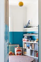 The kids play room is the most colorful room in the house. On the third floor, the existing doors were stripped to reveal the original wood and then painted to match the walls.