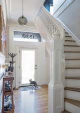Here is a view of the entry with the beautiful stairs leading to the remodeled attic den and master suite addition. 
