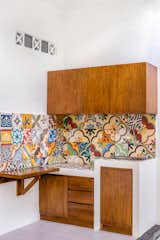 Kitchen, Tile, Wood, Ceramic Tile, Ceramic Tile, Concrete, Dishwasher, Ceiling, Range Hood, and Drop In  Kitchen Tile Range Hood Photos from Prawirotaman Street