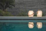 Mimicking the perfect texture and symmetry of silk cocoons,the Ambient Cocoon lantern can be carried around.
