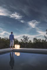 The Ambient Cocoon lantern creates a soft mood lighting with use of integrated solar LED.