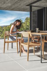 The Archi dining chair, a mix of tactile teak and Dune colored outdoor rope. 