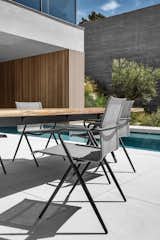 The stackable Ryder dining chair and Split Raw table.