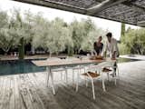 Chair, Table, Outdoor, Large, Wood, Small, Large, Small, Back Yard, Trees, Hardscapes, Swimming, and Gardens Perfect dinner at the Split table with stackable chair Curve.  Outdoor Swimming Back Yard Large Small Gardens Photos from Dining Chairs
