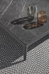 The Grid coffee table with ceramic top is part of a larger lounging collection.