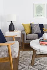 The living room features beautiful window coverings by Austintatious Blinds and furniture by West Elm.