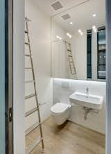 Upper Level: Powder Room (stores rolling ladder for access to the Kitchen and Master Bedroom upper cabinets).